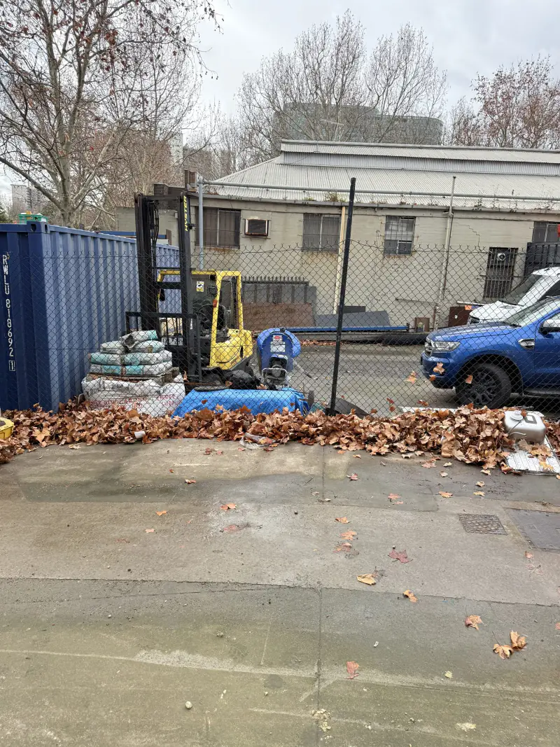 The same yard with every pallet removed and the concrete clear