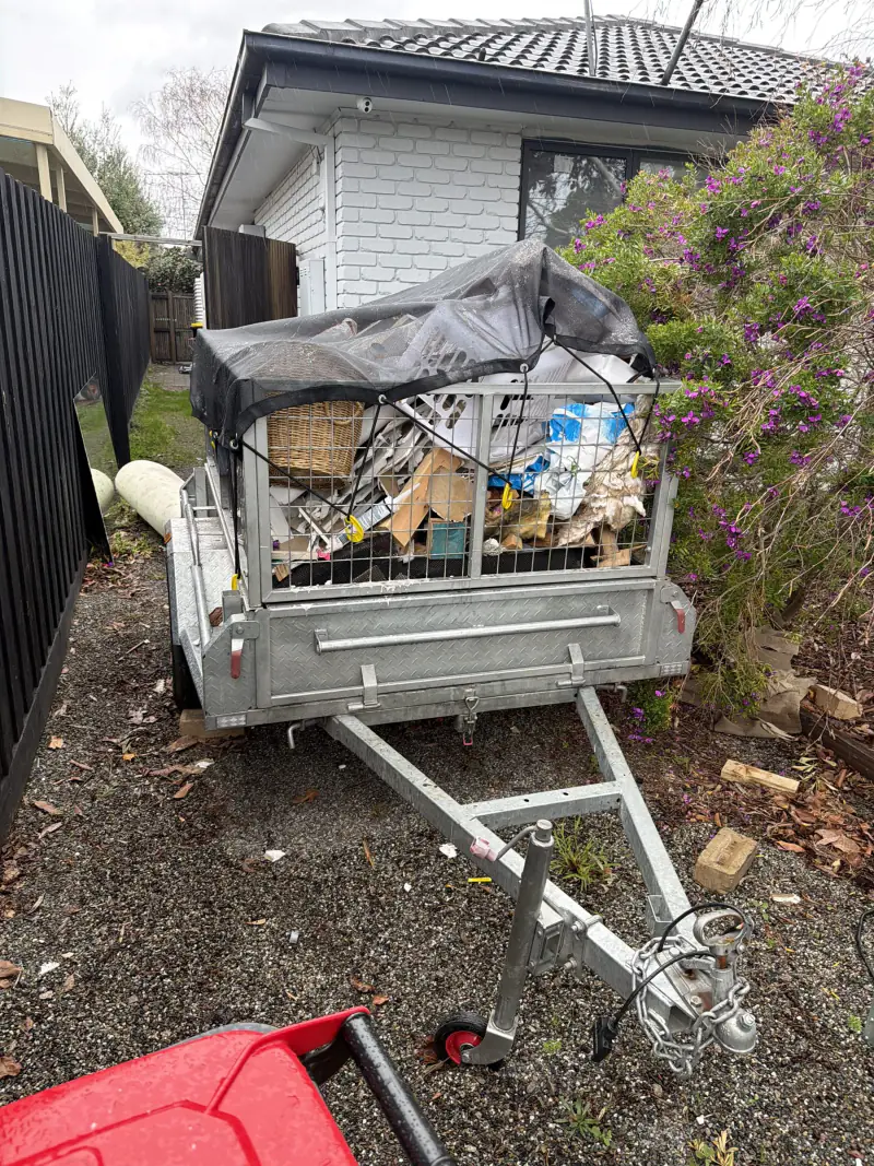 The same trailer loaded and netted with household rubbish at the end of the job